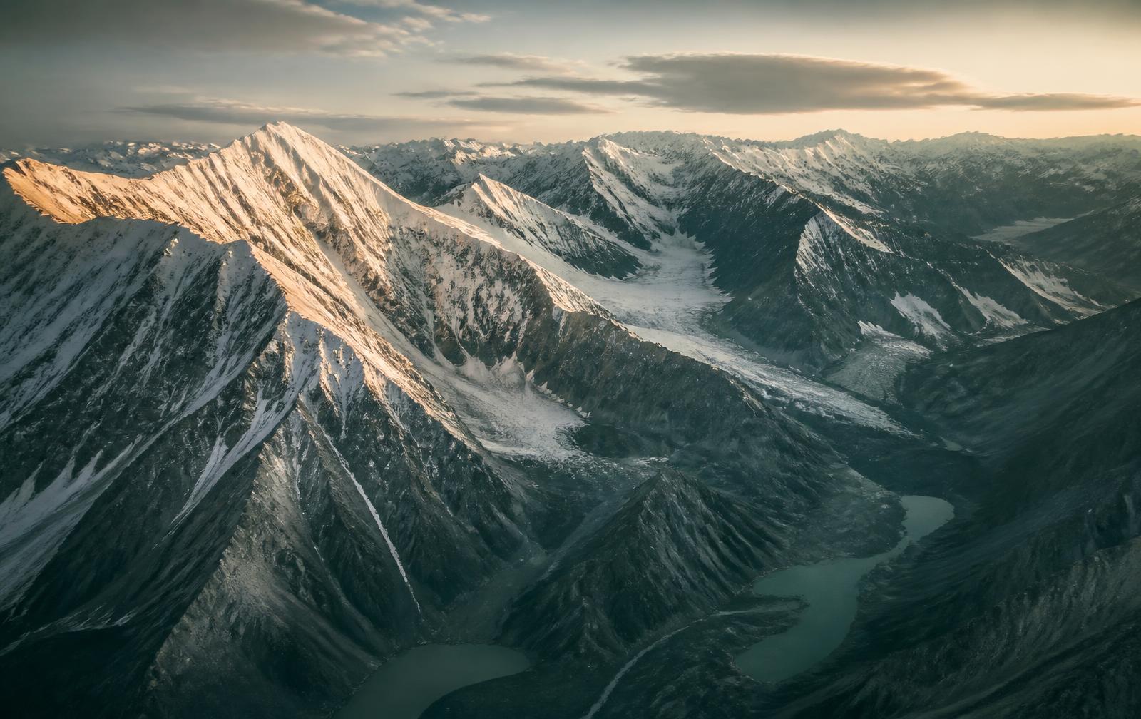 First light on the Southern Alps, snow ridgelines above glacial valleys